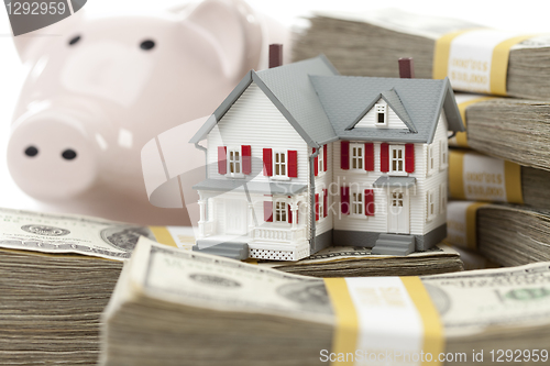 Image of Small House and Piggy Bank with Stacks Money