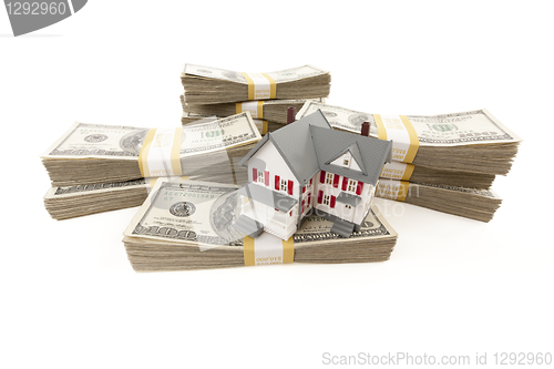 Image of Small House with Stacks of Hundred Dollar Bills