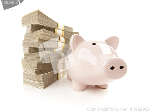 Image of Pink Piggy Bank with Stacks of Money