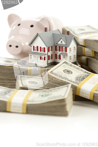 Image of Small House and Piggy Bank with Stacks Money