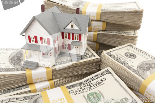 Image of Small House with Stacks of Hundred Dollar Bills