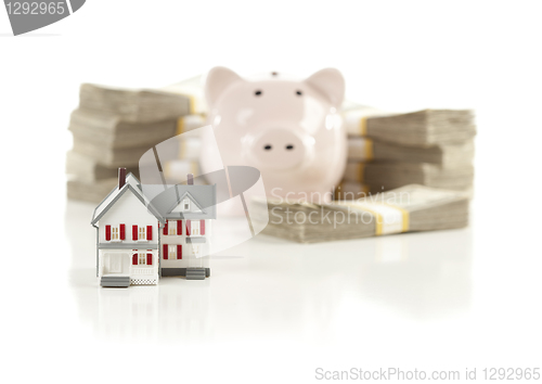 Image of Small House and Piggy Bank with Stacks Money