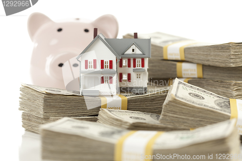 Image of Small House and Piggy Bank with Stacks Money