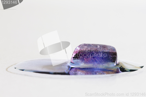 Image of Purple ice cube melting