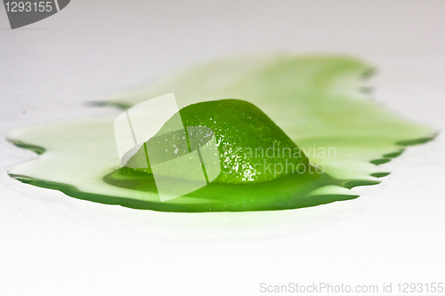 Image of Gooish green ice cube melting