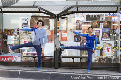 Image of Dancers in a bus selter