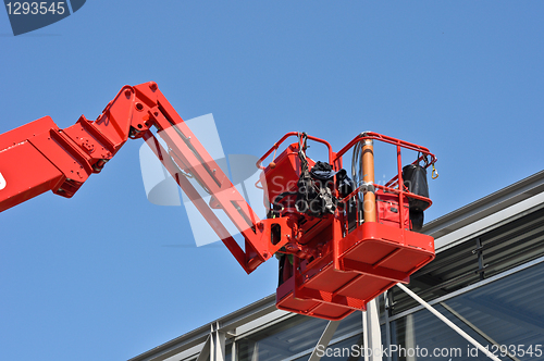 Image of red hydraulic construction cradle 