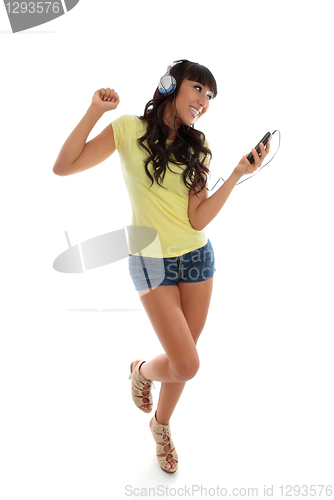 Image of Happy girl playing music dancing