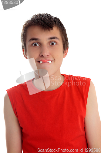 Image of Funny face boy with dracula teeth candy