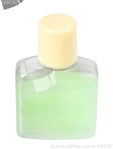 Image of Green cosmetic cream in transparent bottle