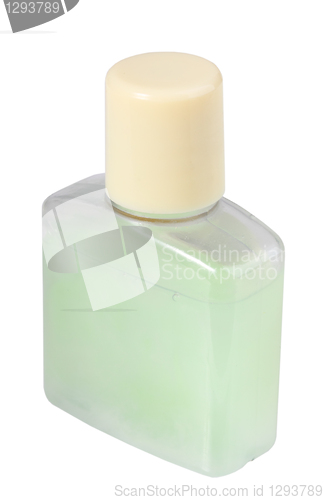 Image of Green cosmetic cream in transparent bottle