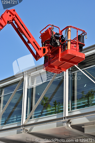 Image of red hydraulic construction cradle 