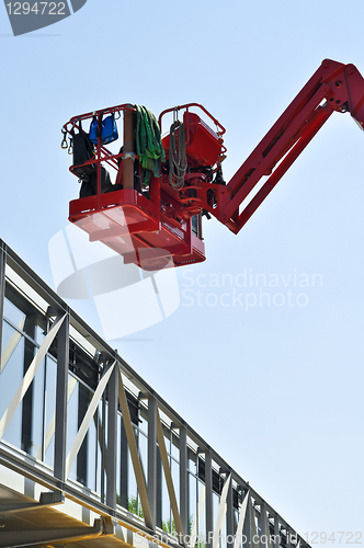 Image of red hydraulic construction cradle 