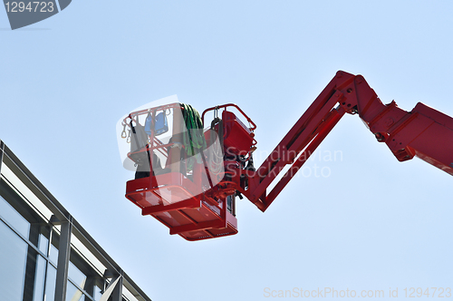 Image of red hydraulic construction cradle 