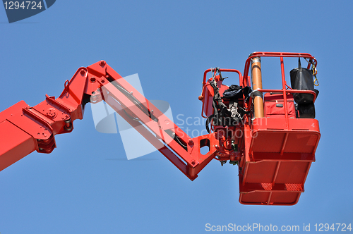 Image of red hydraulic construction cradle 