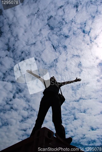 Image of silhouette of a man on the background of sky