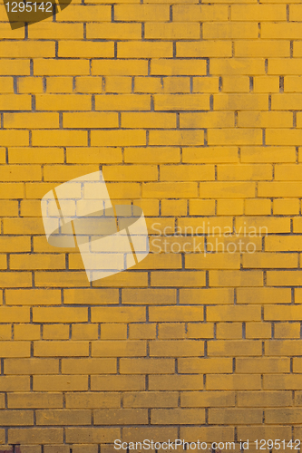 Image of Background with old yellow painted brick wall