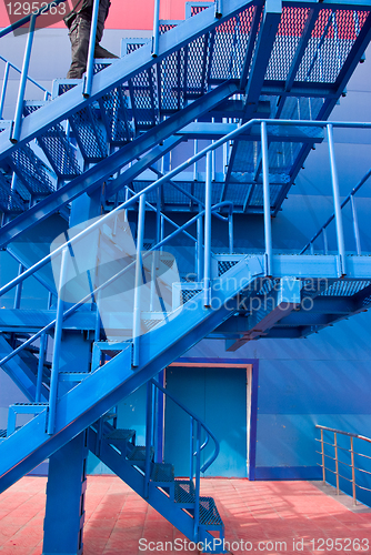 Image of A man running up the stairs