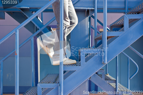 Image of A man running up the stairs