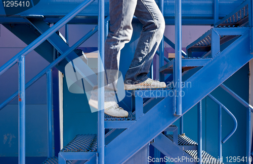 Image of A man running up the stairs