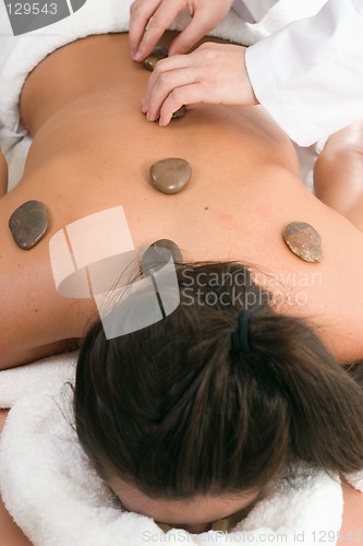 Image of Massage - therapeutic stones placement