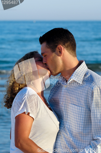 Image of Young couple are kissing.