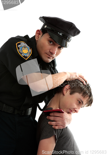 Image of Police officer apprehending a teenage thief