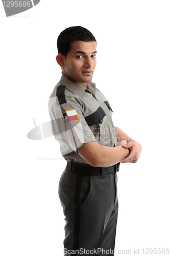 Image of Male worker in uniform standing sideways