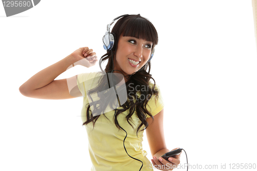 Image of Beautiful girl enjoying music