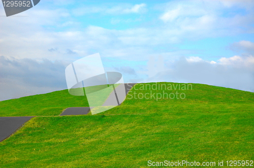 Image of grassland in summer under cloudy sky