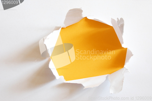 Image of yellow hole in paper
