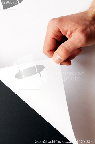 Image of paper and hand