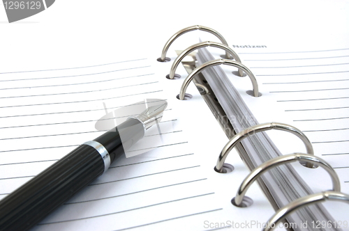 Image of business organizer and pen