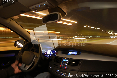 Image of car in motion at night