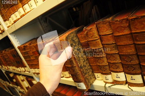Image of old books in a library