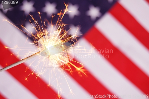 Image of sparkler and usa flag