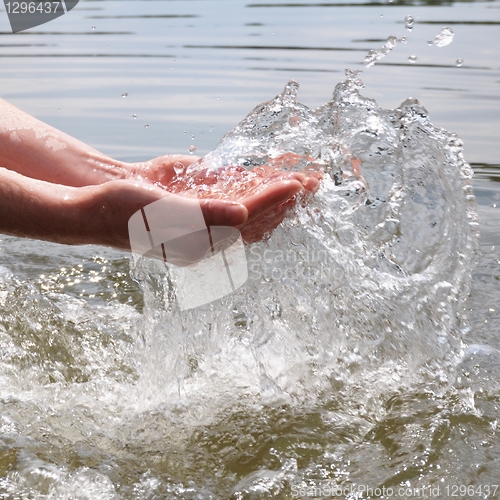 Image of hand an water