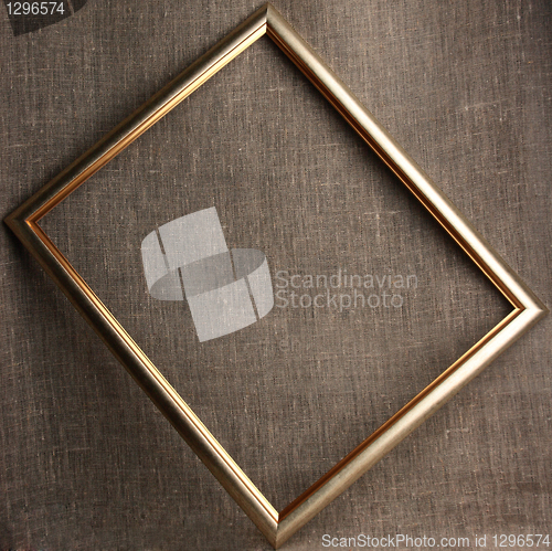 Image of Bronze frame on grunge textile background