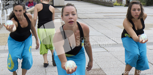 Image of Dancers holding a ball