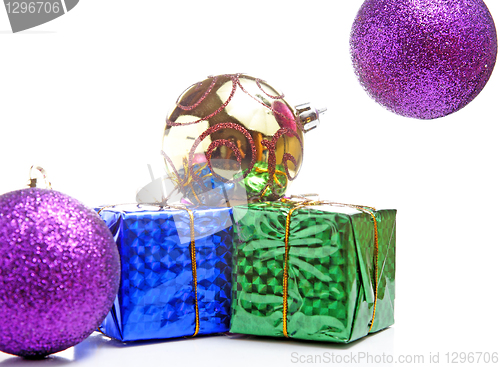 Image of beautiful gifts with gold bows and Christmas ball