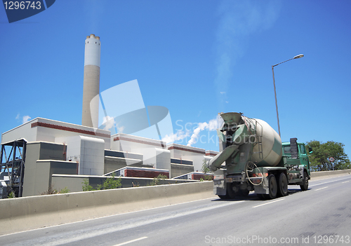 Image of coal fired power station and car moving