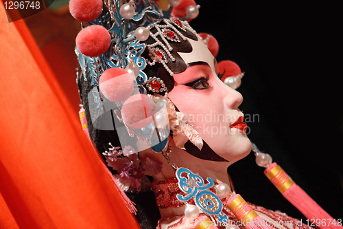 Image of chinese opera dummy and red cloth as text space ,it is a toy,not