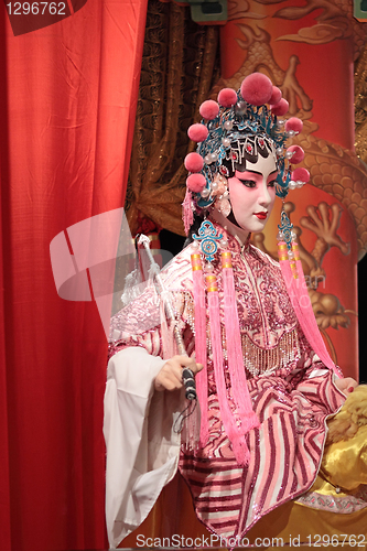 Image of chinese opera dummy and red cloth as text space ,it is a toy,not