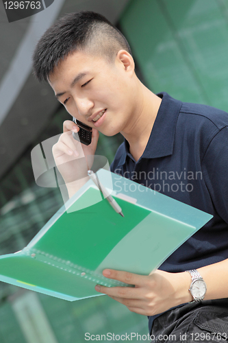 Image of Portrait of businessman calling by phone 