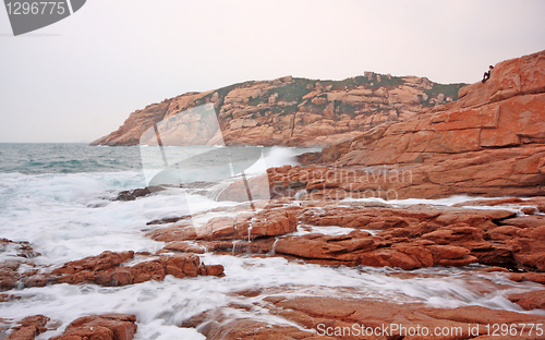 Image of rocky sea coast and blurred water 