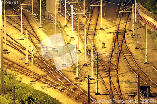 Image of Train tracks in hongkong by night.