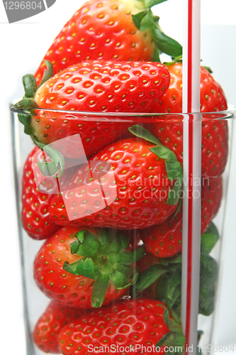 Image of stawberry in glass on white 