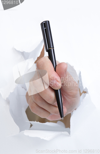 Image of hand with pen 