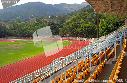 Image of landscape of Coach and reserve benches with seats in football st