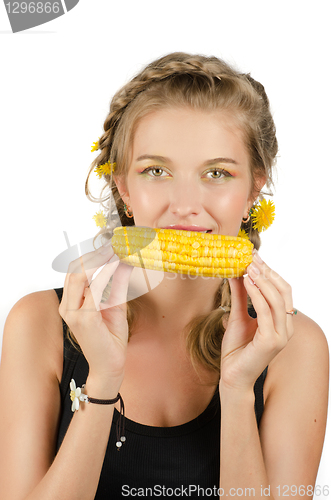 Image of woman eating corn-cob